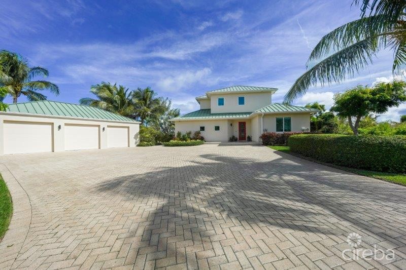 UNIQUE PATRICK’S ISLAND CANAL FRONT HOME WITH GUEST HOUSE AND 3 CAR GARAGE – SOON TO BE GATED!