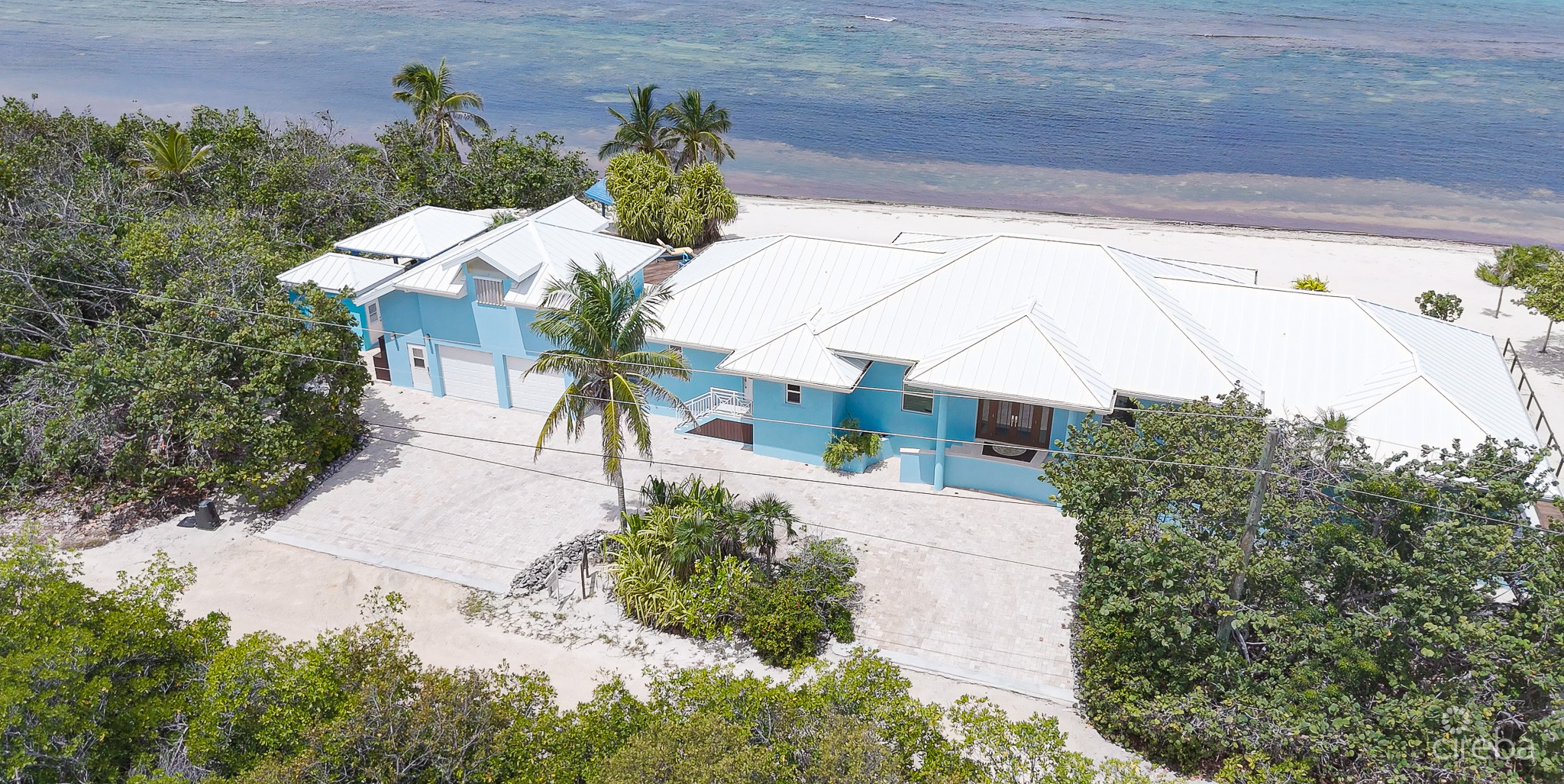 LITTLE CAYMAN BEACHFRONT HOME WITH 2 LOTS AND POOL