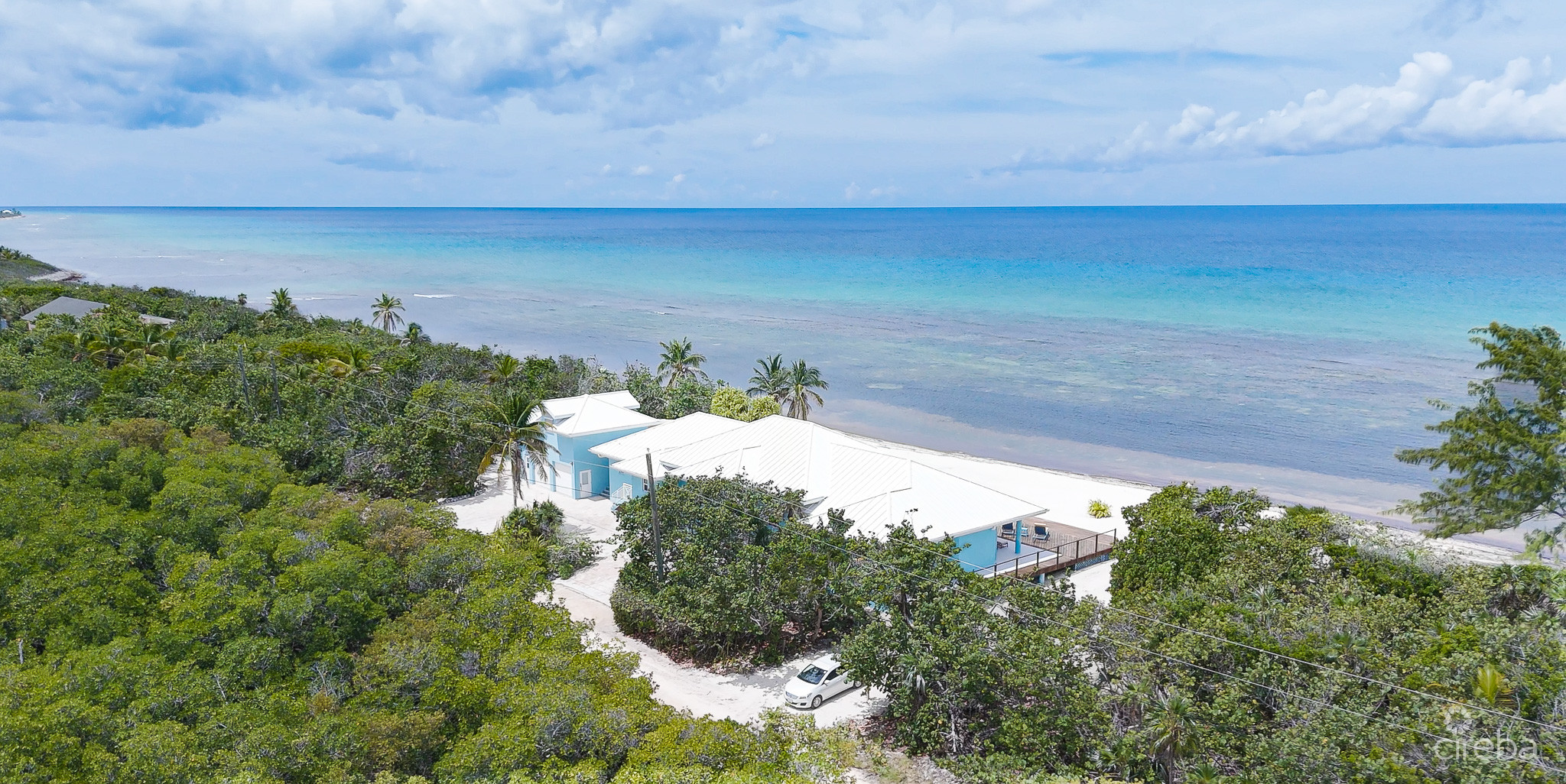 LITTLE CAYMAN BEACHFRONT HOME WITH 2 LOTS AND POOL