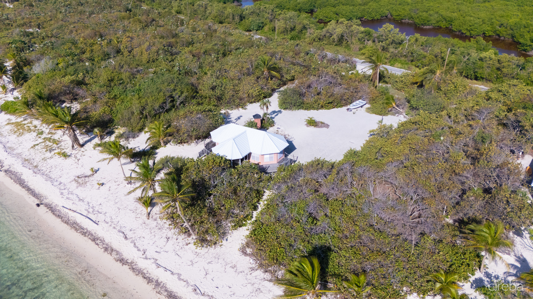 LITTLE CAYMAN LAND WITH BEACHFRONT COTTAGE